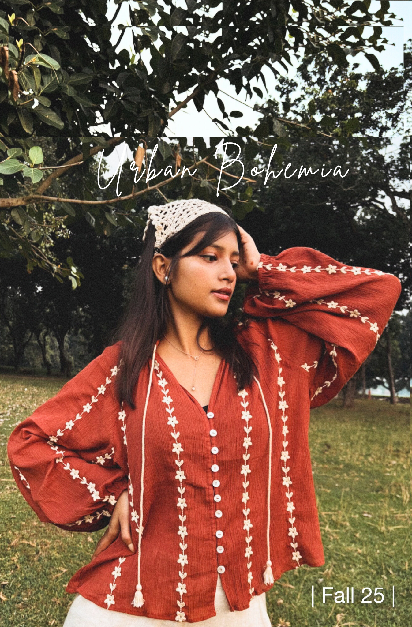 Woman wearing a red blouse with white patterns outdoors, with 'Urban Bohemia' branding.